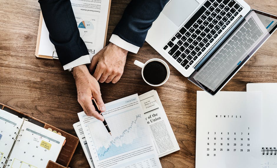 image of desk with papers and coffee